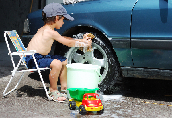 Little Kid Cleaning car